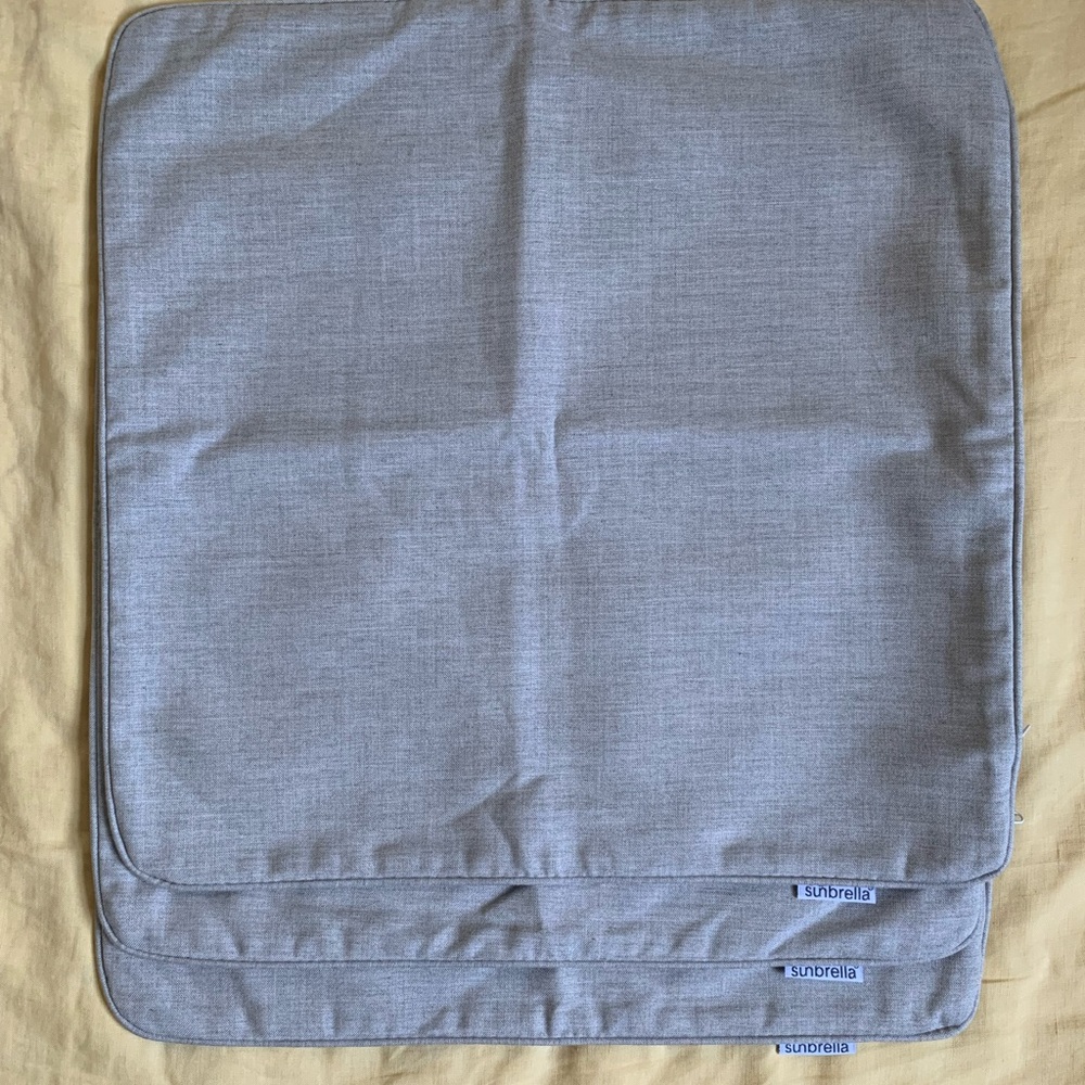 Three grey Sunbrella pillowcases